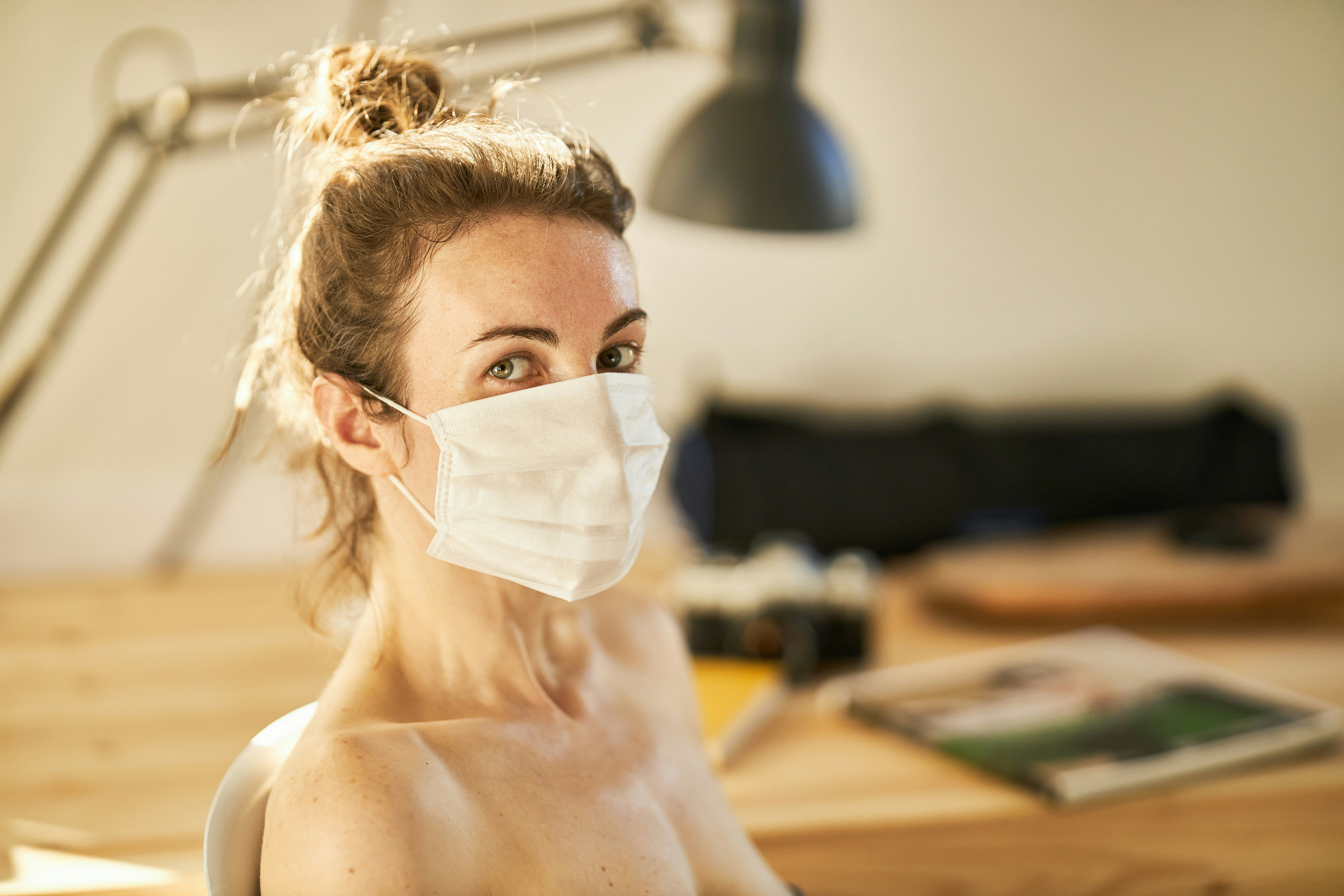 topless woman with white face mask